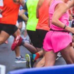 Runners participating in a marathon, wearing colorful athletic gear