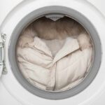 A winter coat inside a washing machine drum