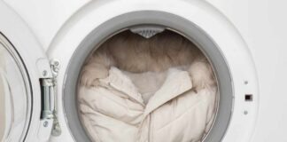 A winter coat inside a washing machine drum