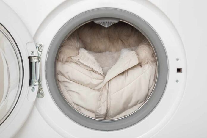 A winter coat inside a washing machine drum