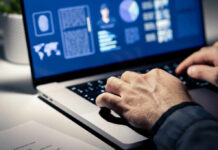 Doctors Rewrite Heart Attack Prevention Rules Close-up of hands typing on a laptop with data visualizations on the screen