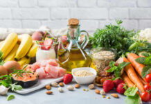 Fiber Supplements: Friend or Foe to Gut Health? A variety of fresh foods including fruits, vegetables, and oils arranged on a table