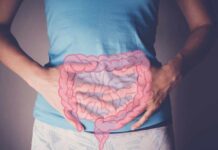 Person holding their stomach with a graphic of intestines overlayed