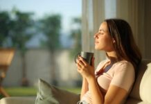 Two Drinks Banish Sleepless Nights Woman enjoying a cup of coffee in a sunlit room