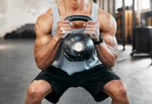 Midlife Muscle Loss: The Hidden Threat Athlete performing a kettlebell squat in a gym