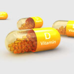 Vitamin D capsules with orange beads inside