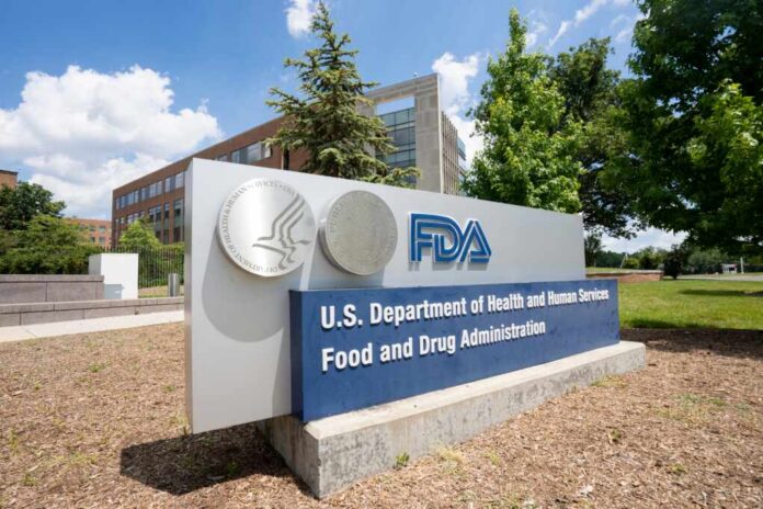 Sign for the U.S. Department of Health and Human Services Food and Drug Administration outside a building