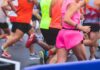 Runners participating in a marathon, wearing colorful athletic gear