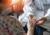 Aging Breakthrough: Routine That Holds Hidden Power A doctor holding the hand of an elderly patient during a consultation