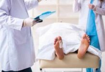Chemo’s Radiation’s Damage—Can We Reverse It? Medical staff stand near a covered body on a gurney with a toe tag