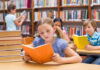 Silent Depression Signal Hiding in Kids’ Eyes Children reading books in a library