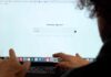 The Blue Light Benefit Nobody Mentions Person interacting with a computer screen displaying a chatbot interface