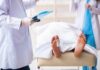 Doctors Sound Alarm: Why Men Keep Dying Too Soon Medical staff stand near a covered body on a gurney with a toe tag