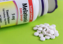 Insomnia: Why Pills No Longer Reign Bottle of melatonin tablets with some pills spilled on a green surface