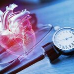 An anatomical heart illustration next to a blood pressure monitor