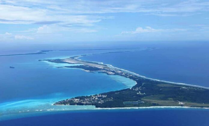 Aerial view of a tropical island surrounded by blue ocean waters