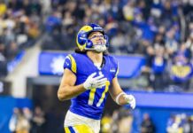 NFL Brain Toll Stuns Researchers Football player in a blue and yellow uniform celebrating during a game