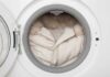 Deadly Dust Hiding In Laundry A winter coat inside a washing machine drum
