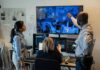 6G: Heartbeat Tracked Through Walls? Security team monitors multiple surveillance screens in control room