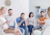 Support group meeting with participants seated in a circle