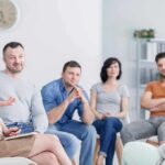 Support group meeting with participants seated in a circle