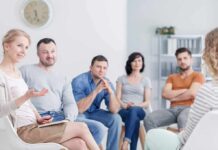 Support group meeting with participants seated in a circle