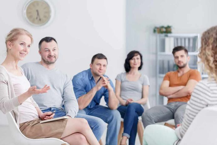 Support group meeting with participants seated in a circle