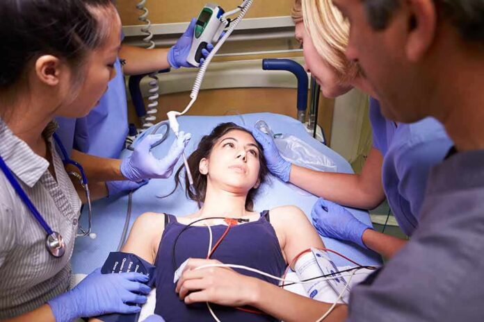 shutterstock_168768599 Patient on hospital gurney surrounded by medical staff