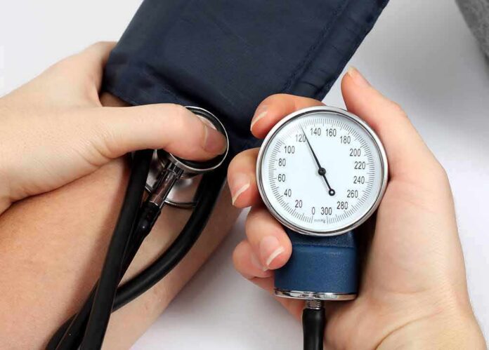 1783875843944-fjuqt8-shutterstock-93341521-1 Blood pressure measurement with sphygmomanometer and stethoscope