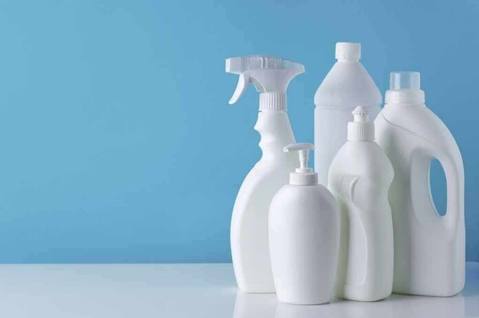 1783889280602-8clh6m-shutterstock-1723883560 White plastic cleaning bottles against a blue background