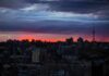 How City Air Is Killing Your Cells city skyline at dusk with dramatic clouds and orange horizon
