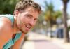 What Underfueling Actually Does To Your Body man in athletic tank top resting outdoors
