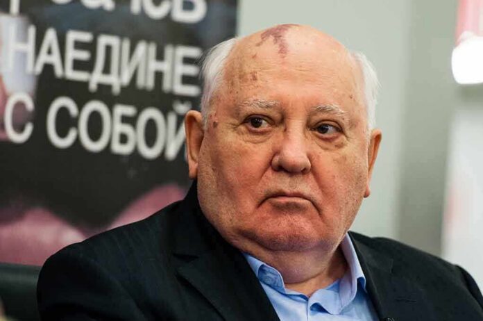 Man with bald head and birthmark looks to the side, identified as Mikhail Tumanishvili