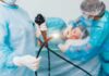 Bizarre FDA Device: Drain Stomach, Drop Pounds Medical staff preparing endoscope near patient on hospital bed