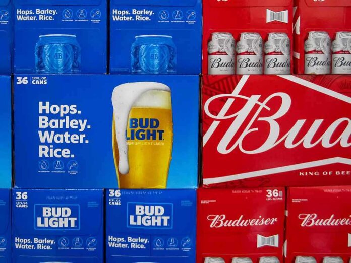 shutterstock_1368170357 Stacks of Bud Light and Budweiser beer cases