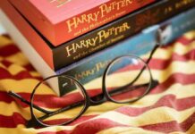 Alzheimer’s Odds Plunge With Page-Turners Round black glasses on striped scarf beside Harry Potter books