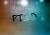 Condensation on glass with PTSD written in the moisture