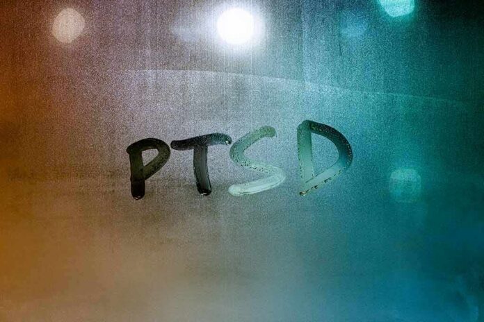 Condensation on glass with PTSD written in the moisture
