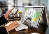 Person using phone and laptop with real estate map app