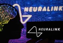 Mind-To-Mouth Breakthrough Stuns ALS Family Silhouette of a head with circuitry beside Neuralink logos