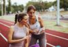 Cardio vs Weights? Doctors End the Feud Two women at a running track looking at a tablet