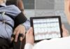 Too Much Sleep, Big Trouble Technician reviews polygraph readings on a tablet beside a seated subject