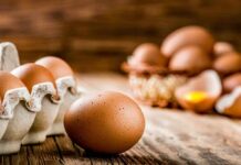 FDA Draws a Hard Line on Raw Eggs Brown eggs on rustic wooden table