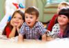 The Worst Ages for Kids to Experience Divorce A group of children enjoying playtime indoors, displaying joyful expressions