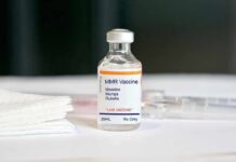 Cancer Breakthrough Leak Triggers Wall Street Panic MMR vaccine vial on a white surface