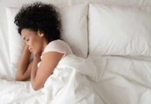 Bedtime Mistake Torches the Spine Woman sleeping on white bedding