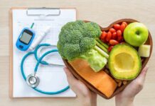 Heart-shaped bowl of healthy foods with medical tools
