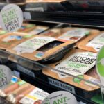 Plant-based burger patties in a grocery store cooler