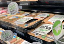 Plant-based burger patties in a grocery store cooler