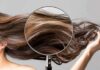 FDA Slaps ‘Hair Growth’ Shampoos Magnifying glass highlighting long brown hair